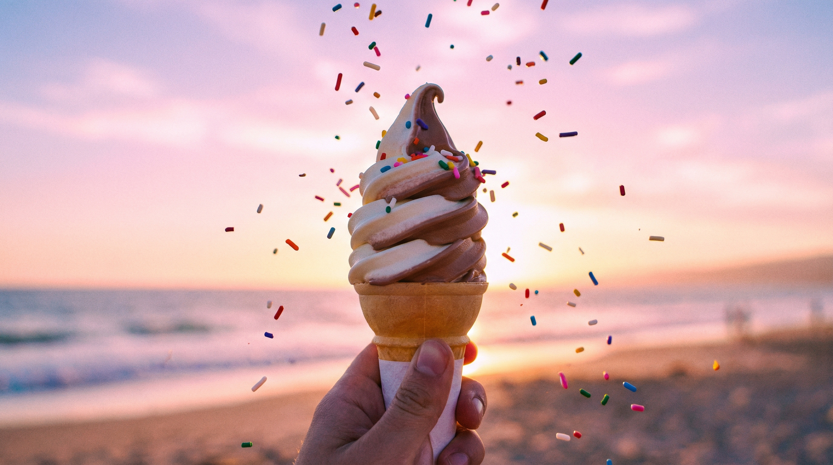 Soft serve ice cream cone with sprinkles